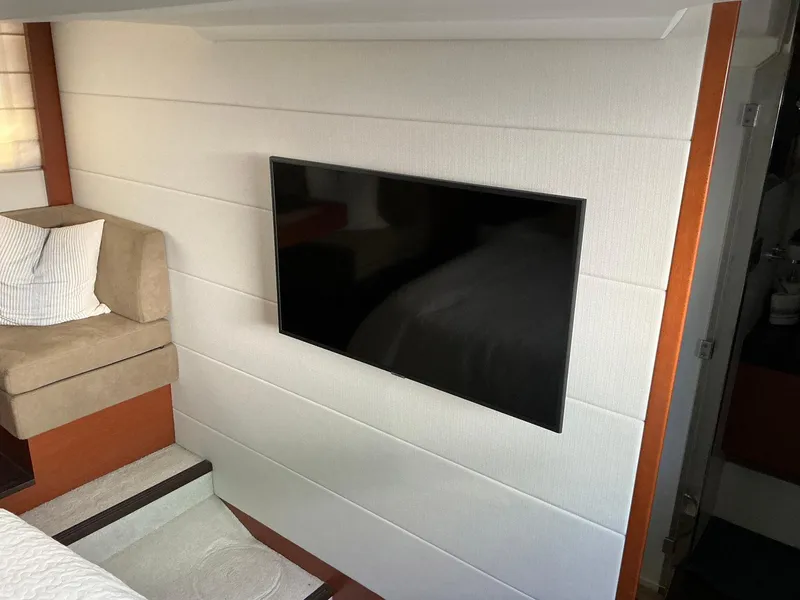 Slide: The Image of Interior of 2015 Prestige 500 yacht with wall-mounted TV and seating area. - 34