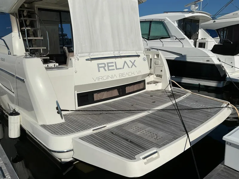 Slide: The Image of Luxury 2015 Prestige 500 yacht docked, featuring spacious deck and "Relax" signage. - 4