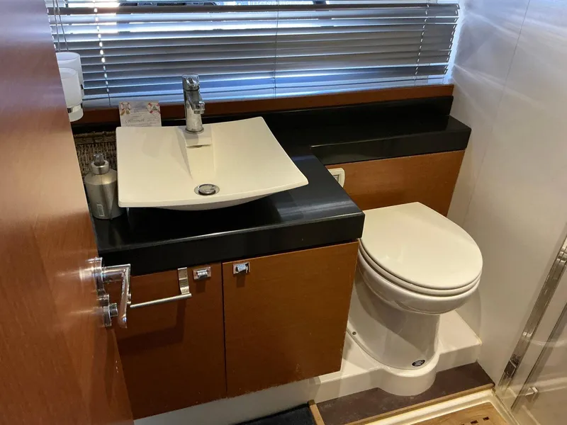 Slide: The Image of Luxurious bathroom in 2015 Prestige 500 yacht with modern sink and toilet. - 44
