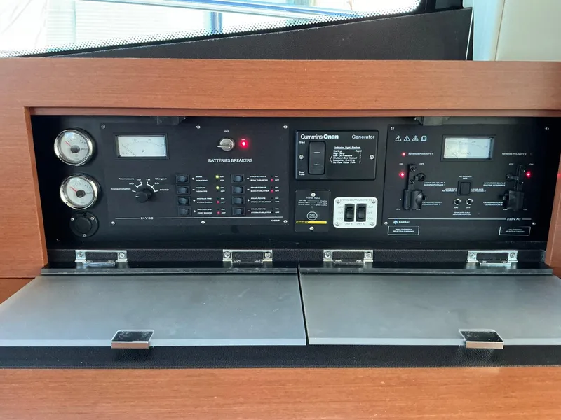 Slide: The Image of Control panel of a 2015 Prestige 500 yacht, featuring gauges and switches. - 48