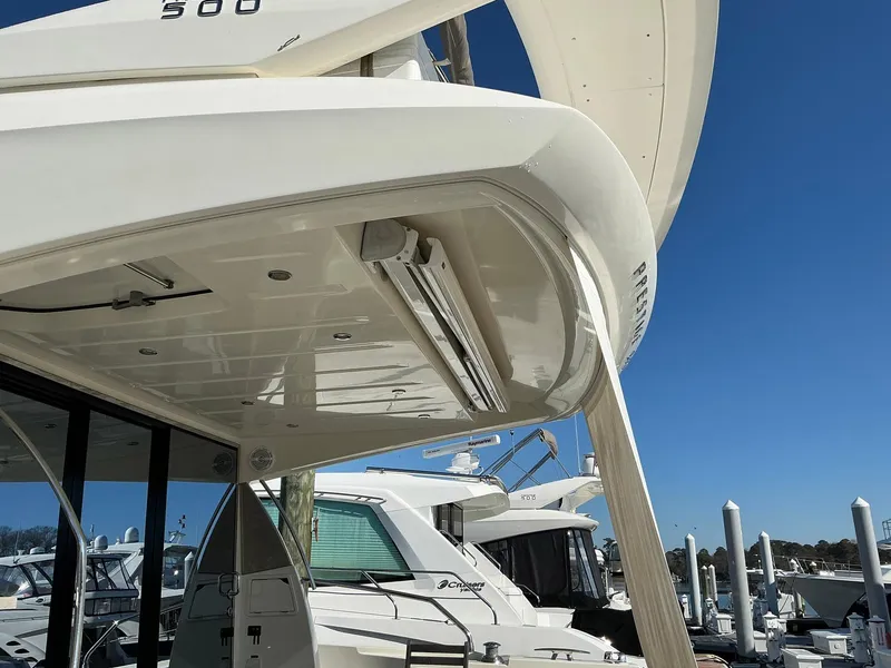 Slide: The Image of 2015 Prestige 500 yacht docked under clear blue sky. - 8