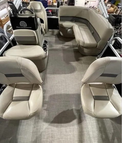 Slide: The Image of 2022 Sun Tracker BB16 boat interior with beige seating and modern design. - 10