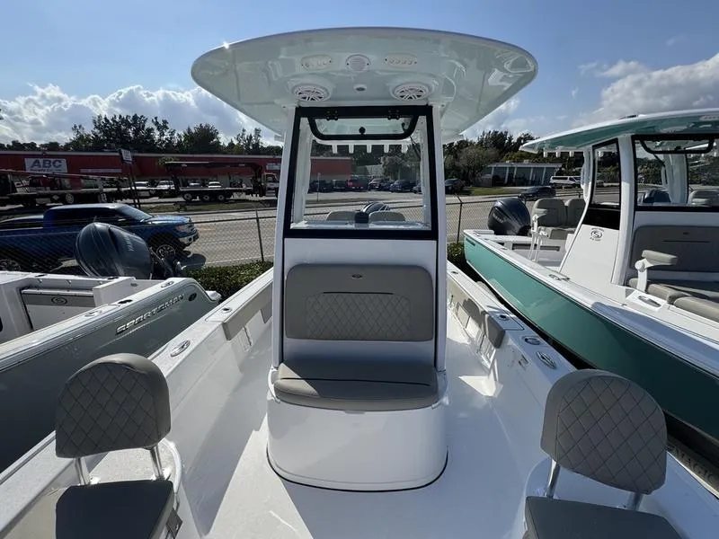 Slide: The Image of 2025 Sportsman Masters 227 boat interior with seating and console, displayed outdoors. - 10