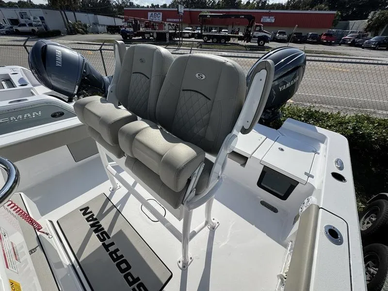 Slide: The Image of 2025 Sportsman Masters 227 boat with dual Yamaha engines and cushioned seating. - 14