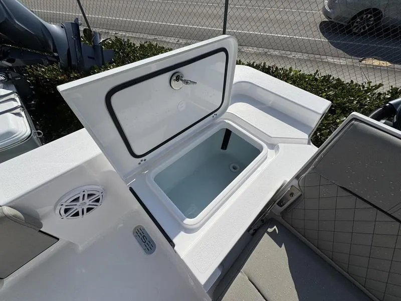 Slide: The Image of Open storage compartment on 2025 Sportsman Masters 227 boat, featuring a sleek design. - 23