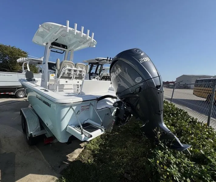 Slide: The Image of 2025 Sportsman Masters 227 boat with Yamaha 200 engine, parked outdoors. - 26