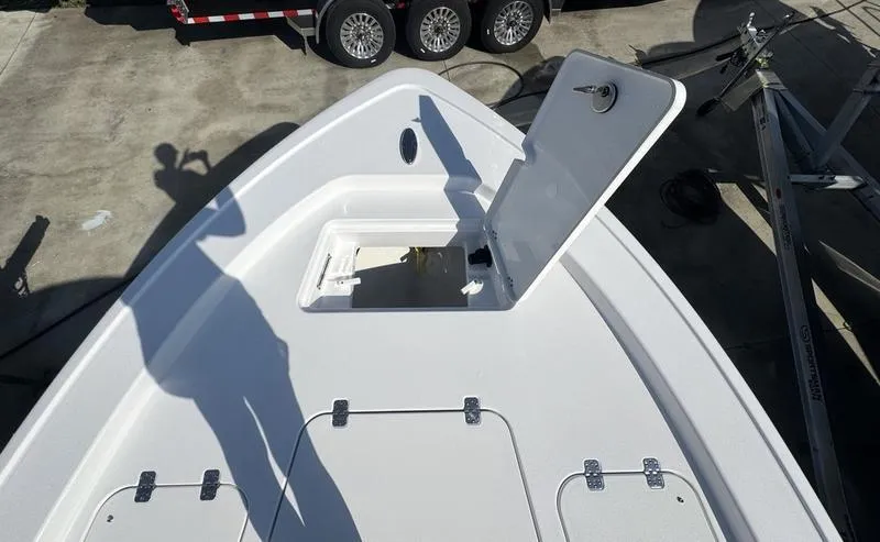 Slide: The Image of 2025 Sportsman Masters 227 boat deck with open storage compartment. - 3