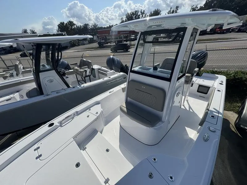 Slide: The Image of 2025 Sportsman Masters 227 boat with sleek design and modern features, docked outdoors. - 6
