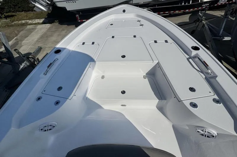 Slide: The Image of 2025 Sportsman Masters 227 boat deck with storage compartments and speakers. - 7