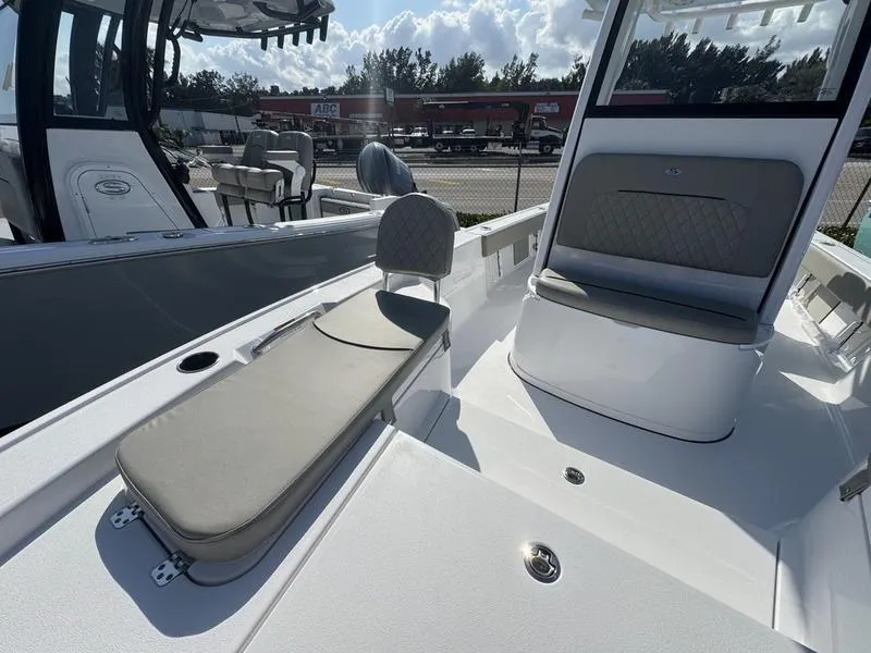Slide: The Image of 2025 Sportsman Masters 227 boat interior with cushioned seating and sleek design. - 9