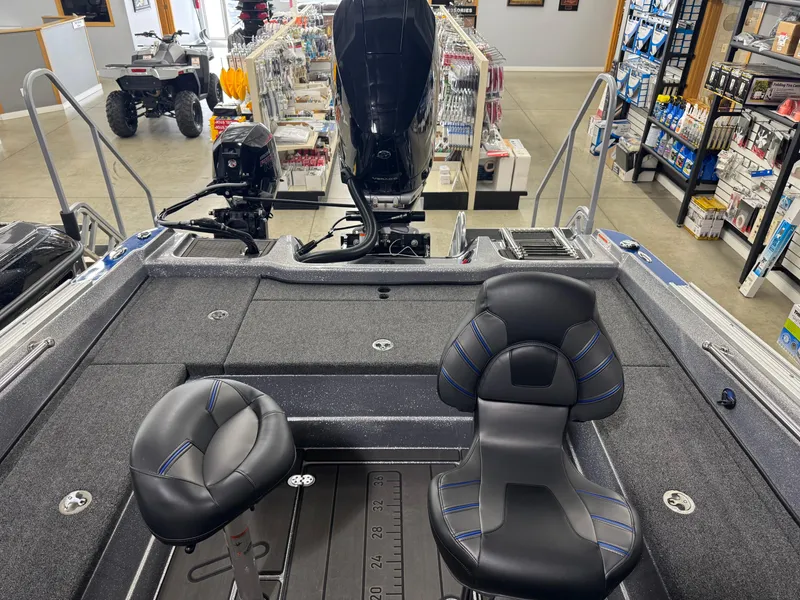 Slide: The Image of Interior of 2025 Nitro ZV21 boat with seating and motor, displayed in showroom. - 10