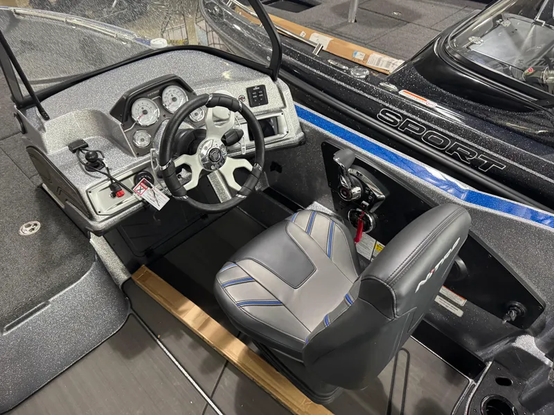 Slide: The Image of 2025 Nitro ZV21 boat cockpit with steering wheel and control panel. - 11