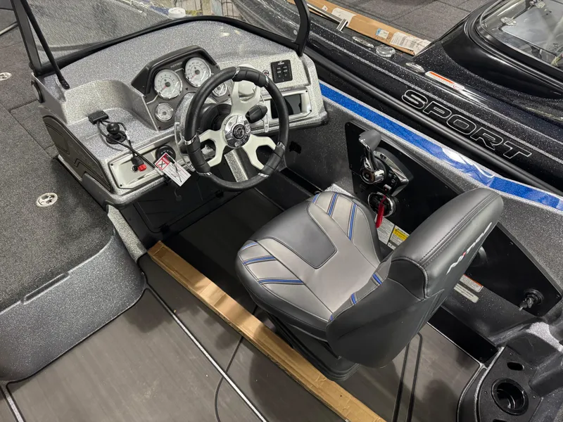 Slide: The Image of Interior of 2025 Nitro ZV21 boat, featuring steering wheel and dashboard controls. - 13