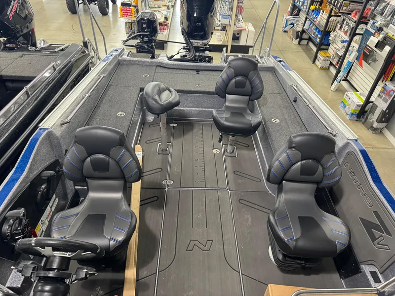 Slide: The Image of 2025 Nitro ZV21 boat interior with four black seats, spacious deck, and modern design. - 21