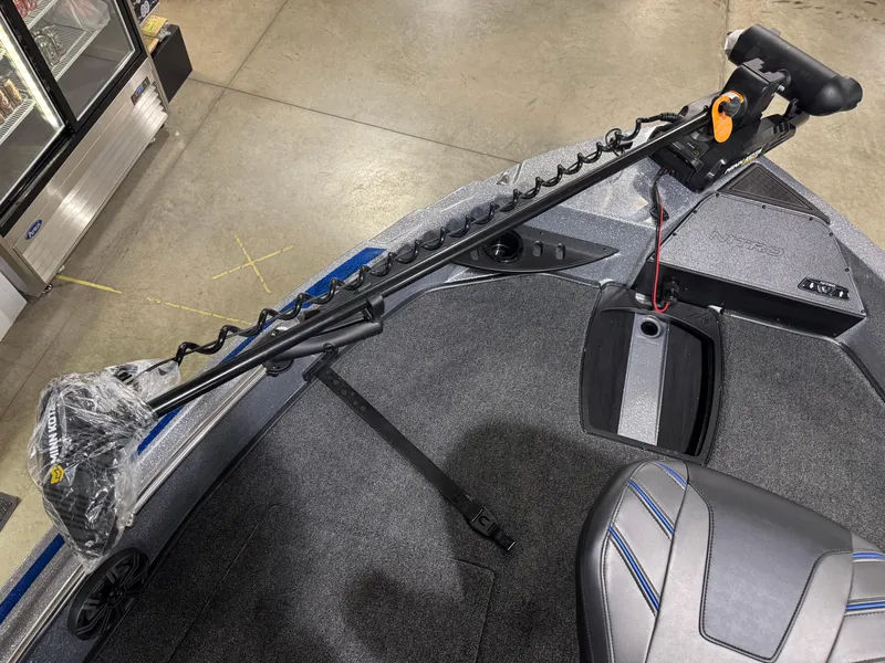 Slide: The Image of 2025 Nitro ZV21 boat interior with trolling motor and seating. - 23