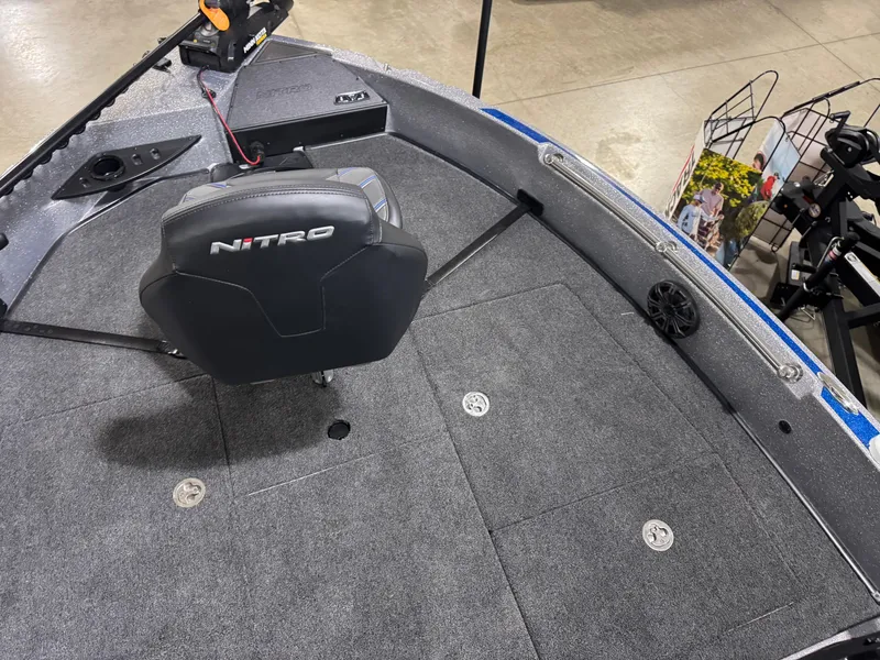 Slide: The Image of 2025 Nitro ZV21 boat interior with seating and carpeted deck. - 6