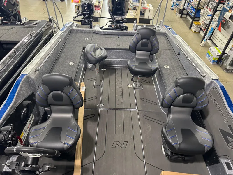 Slide: The Image of 2025 Nitro ZV21 boat interior with four black seats and spacious deck layout. - 9