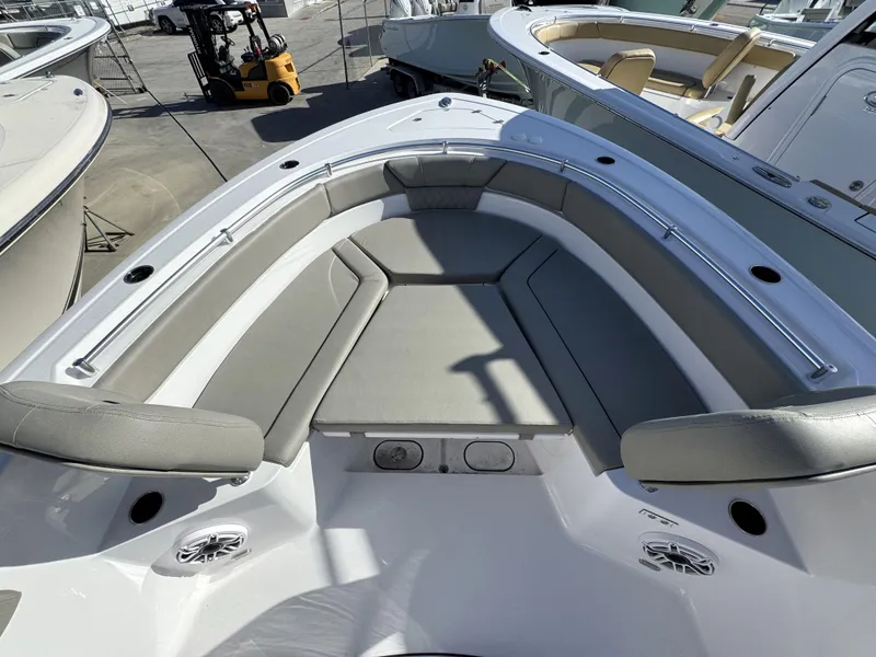 Slide: The Image of 2025 Sportsman Heritage 261 boat interior with cushioned seating and modern design. - 12