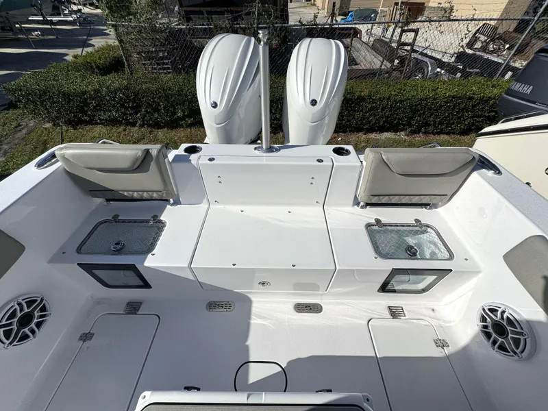 Slide: The Image of 2025 Sportsman Heritage 261 boat deck with dual engines and seating area. - 20