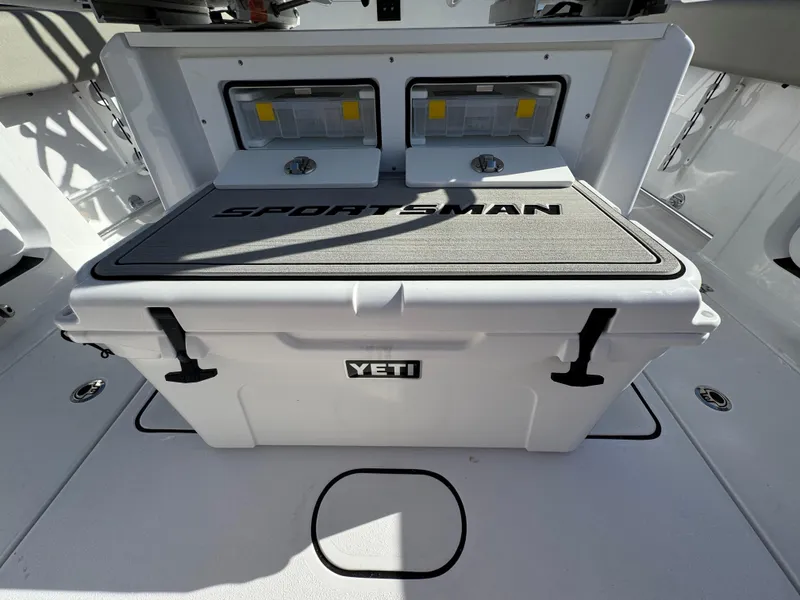 Slide: The Image of 2025 Sportsman Heritage 261 boat with Yeti cooler on deck. - 29