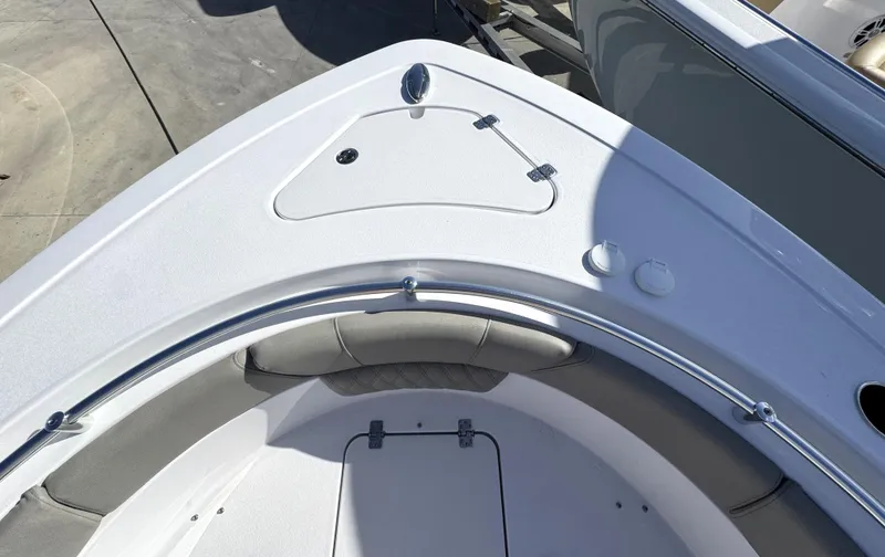 Slide: The Image of 2025 Sportsman Heritage 261 boat deck with seating and storage compartments. - 3