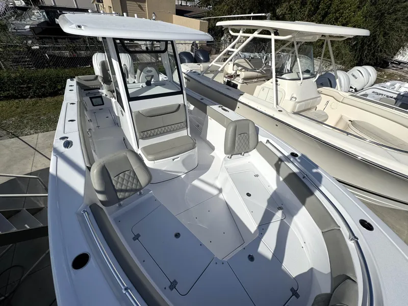 Slide: The Image of 2025 Sportsman Heritage 261 boat with spacious seating and modern design. - 5