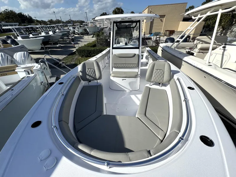 Slide: The Image of 2025 Sportsman Heritage 261 boat with spacious seating and modern design. - 9