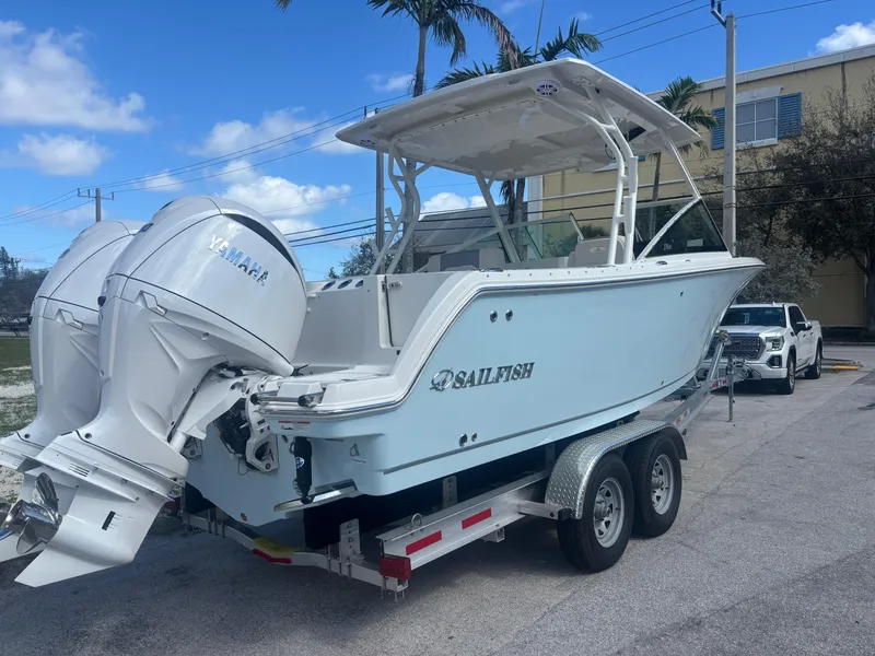 Slide: The Image of 2025 Sailfish 276 DC boat on trailer with Yamaha outboard motor. - 1