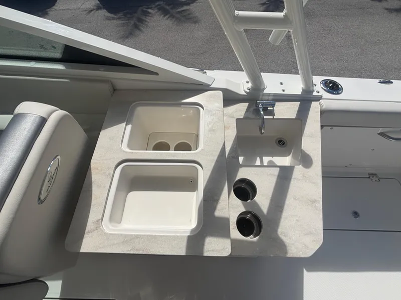 Slide: The Image of 2025 Sailfish 276 DC boat interior with sink and storage compartments. - 18