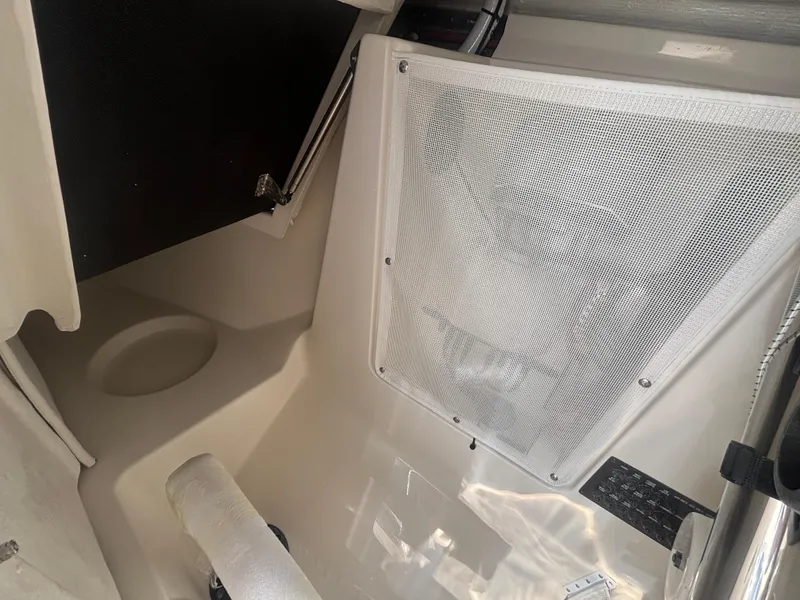 Slide: The Image of Interior view of 2025 Sailfish 276 DC boat cabin with storage netting. - 21