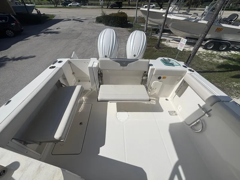 Slide: The Image of 2025 Sailfish 276 DC boat interior with seating and storage compartments. - 24