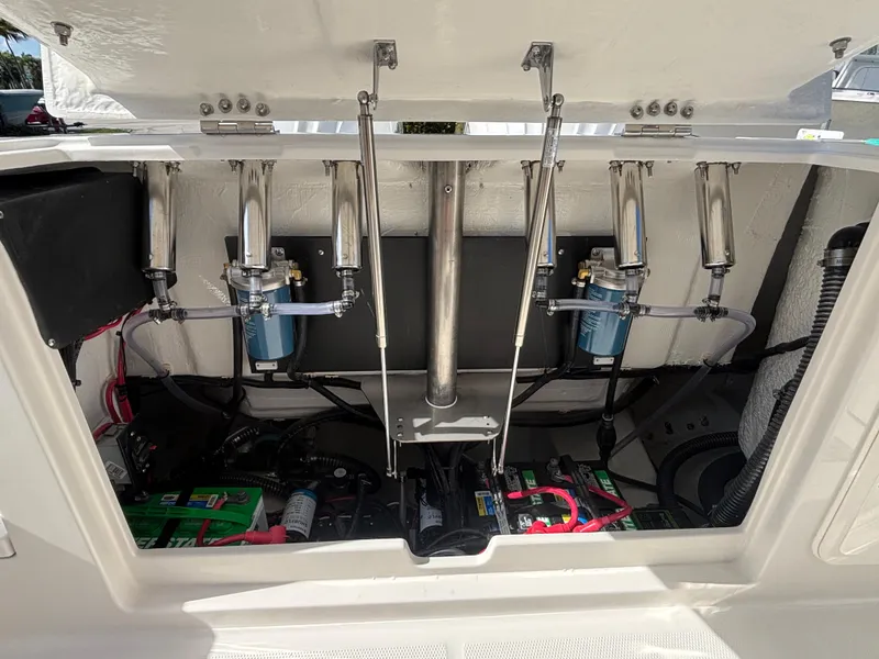 Slide: The Image of 2025 Sailfish 276 DC boat engine compartment with hydraulic systems and wiring. - 27