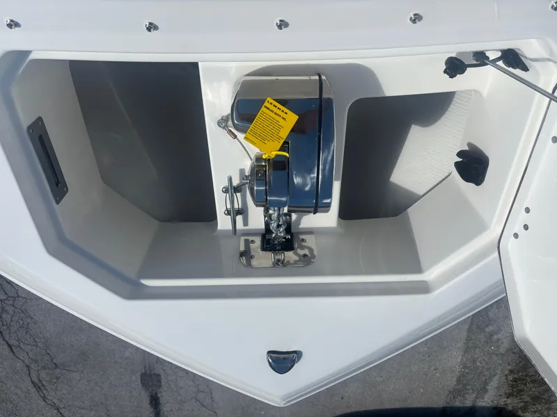 Slide: The Image of Anchor compartment of 2025 Sailfish 276 DC boat, featuring a modern design. - 7