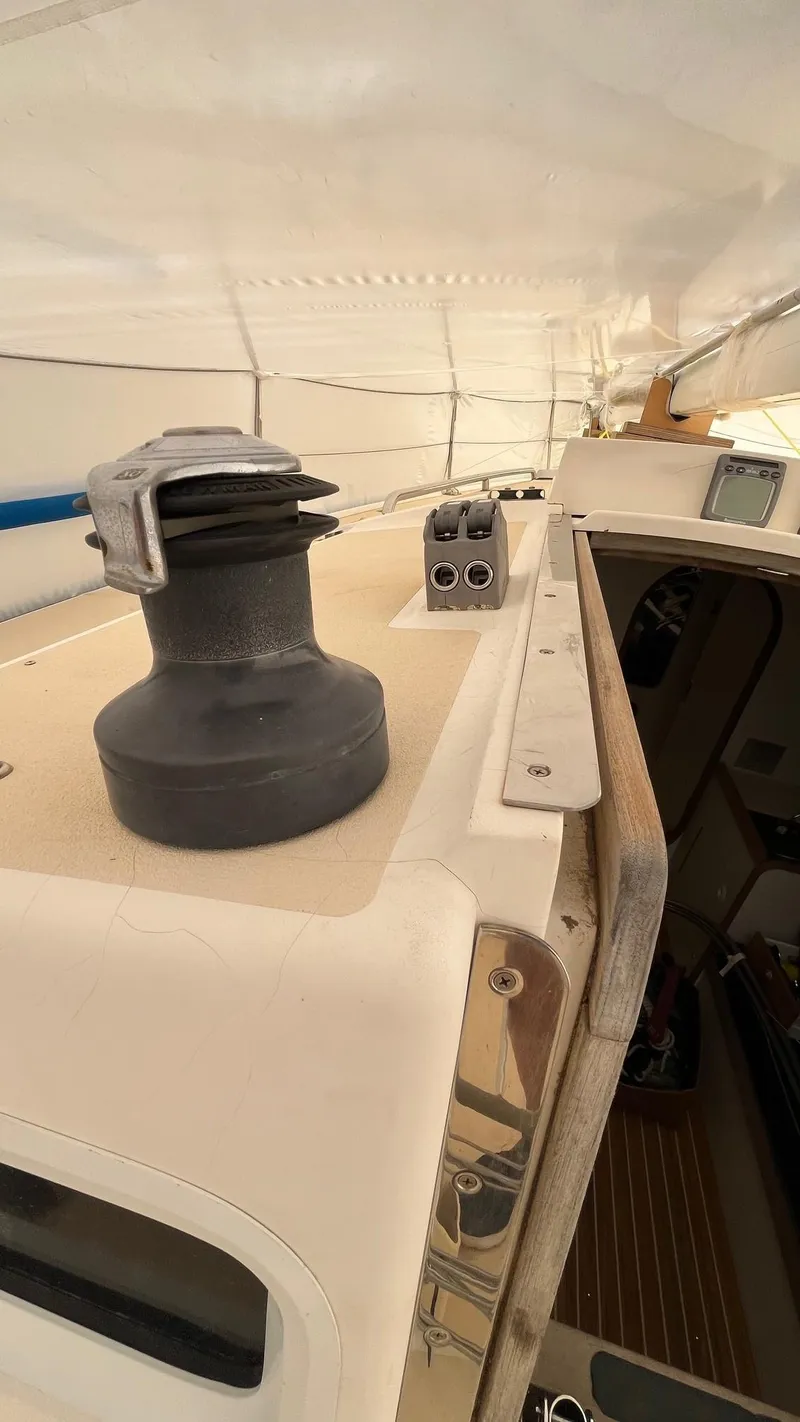 Slide: The Image of 2000 J Boats J/105 sailboat deck with winch and cabin entrance. - 10