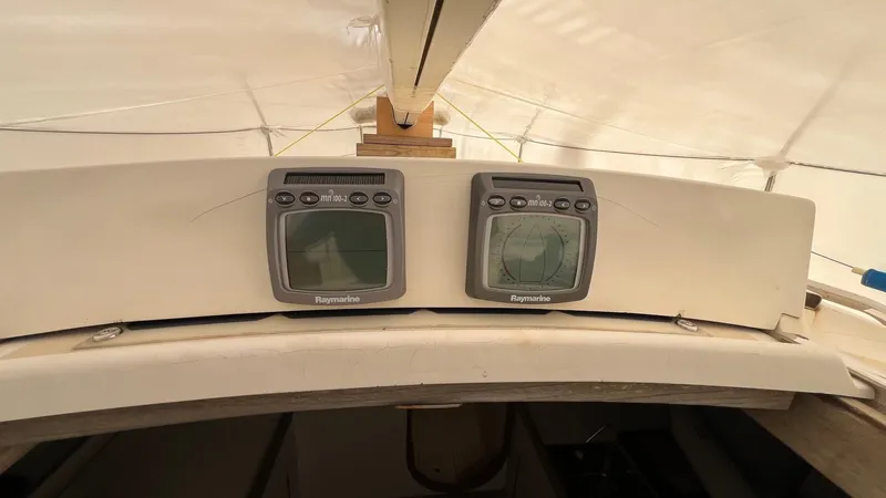 Slide: The Image of Cockpit instruments on a 2000 J Boats J/105 sailboat under a protective cover. - 11
