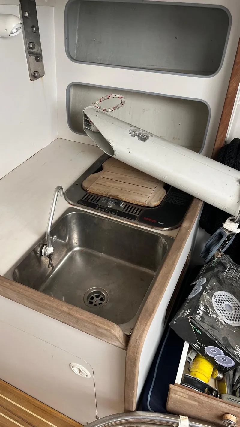 Slide: The Image of Small kitchen sink area on a 2000 J Boats J/105 sailboat. - 17