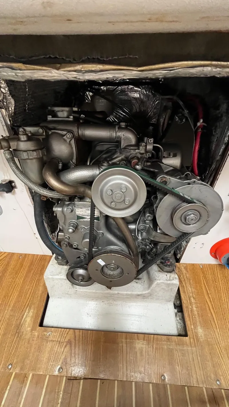 Slide: The Image of Engine compartment of a 2000 J Boats J/105 sailboat, showcasing mechanical components. - 19