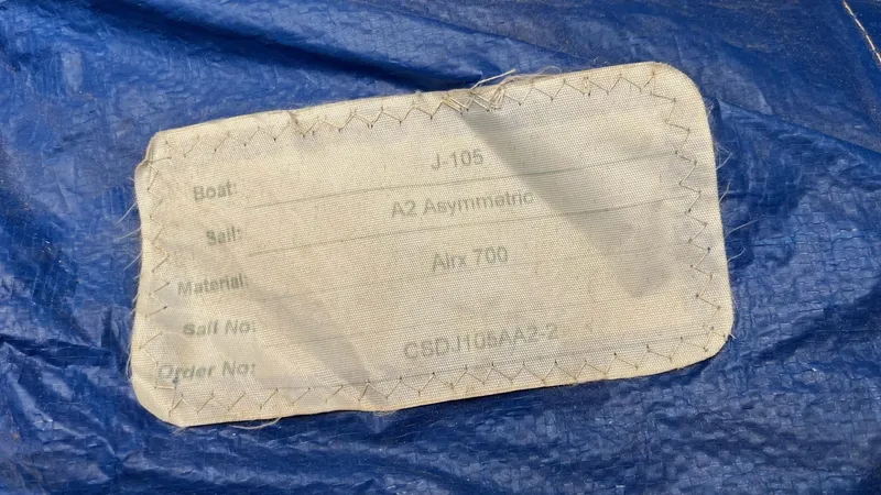 Slide: The Image of Label on blue sail for J Boats J/105, year 2000, detailing specifications. - 20