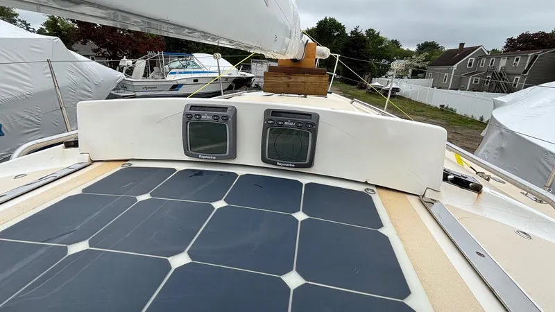 Slide: The Image of 2000 J Boats J/105 sailboat with solar panels and navigation instruments on deck. - 22
