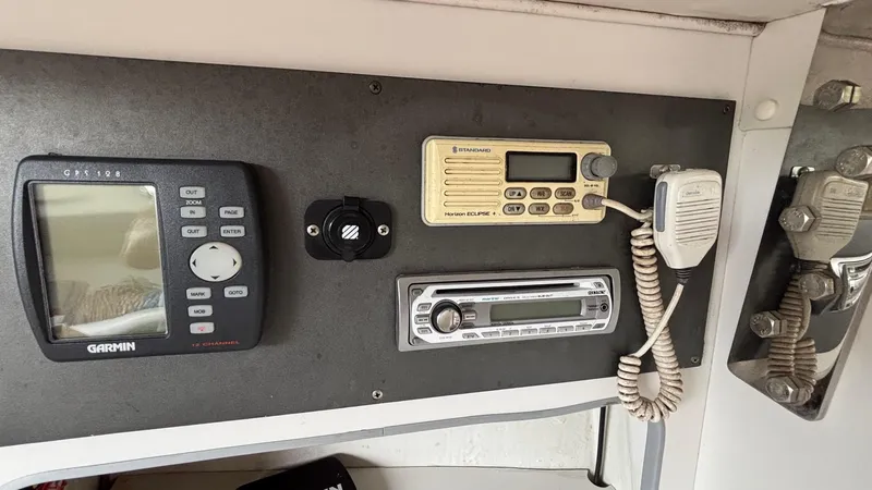 Slide: The Image of Control panel of a 2000 J Boats J/105 with Garmin and communication devices. - 23