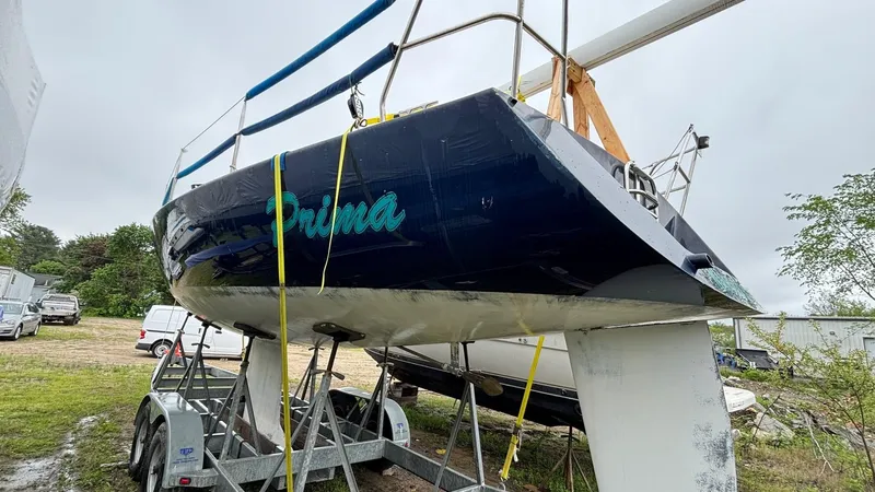 Slide: The Image of 2000 J Boats J/105 sailboat on trailer, blue hull, overcast day. - 31