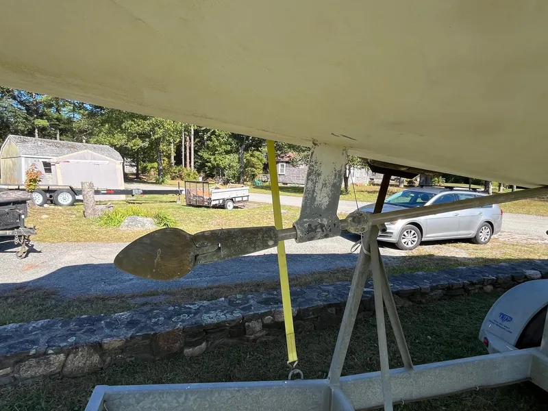 Slide: The Image of 2000 J Boats J/105 sailboat propeller and rudder on a stand outdoors. - 5