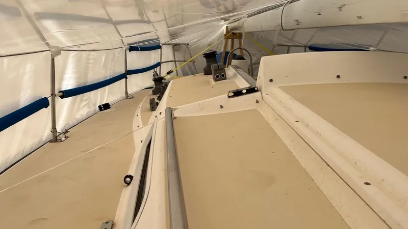 Slide: The Image of Interior view of a 2000 J Boats J/105 sailboat under protective cover. - 9