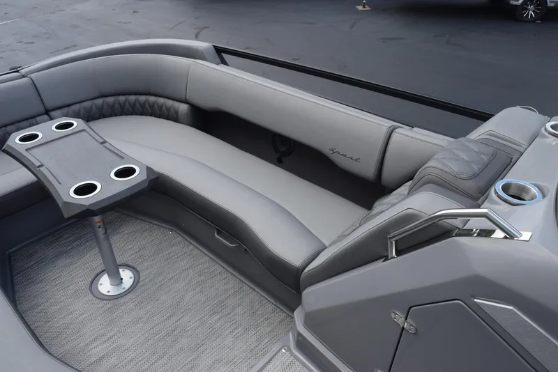 Slide: The Image of 2023 Bennington 25 RTFB boat interior with gray seating and cup holders. - 10