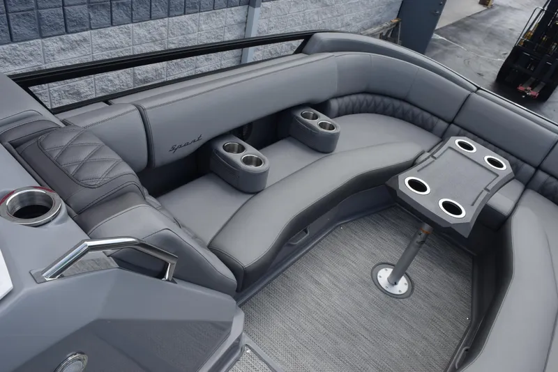 Slide: The Image of 2023 Bennington 25 RTFB boat interior with gray seating and cup holders. - 11