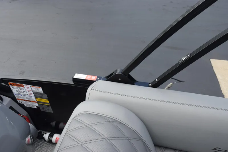 Slide: The Image of 2023 Bennington 25 RTFB boat interior with gray seating and safety equipment. - 15