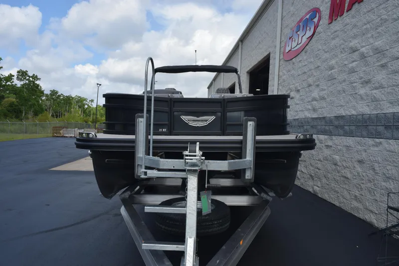 Slide: The Image of 2023 Bennington 25 RTFB boat on trailer outside dealership. - 3
