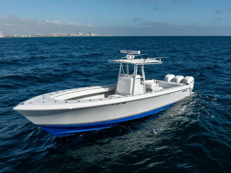 Slide: The Image of 2006 Contender 33 Tournament boat cruising on open ocean waters. - 15