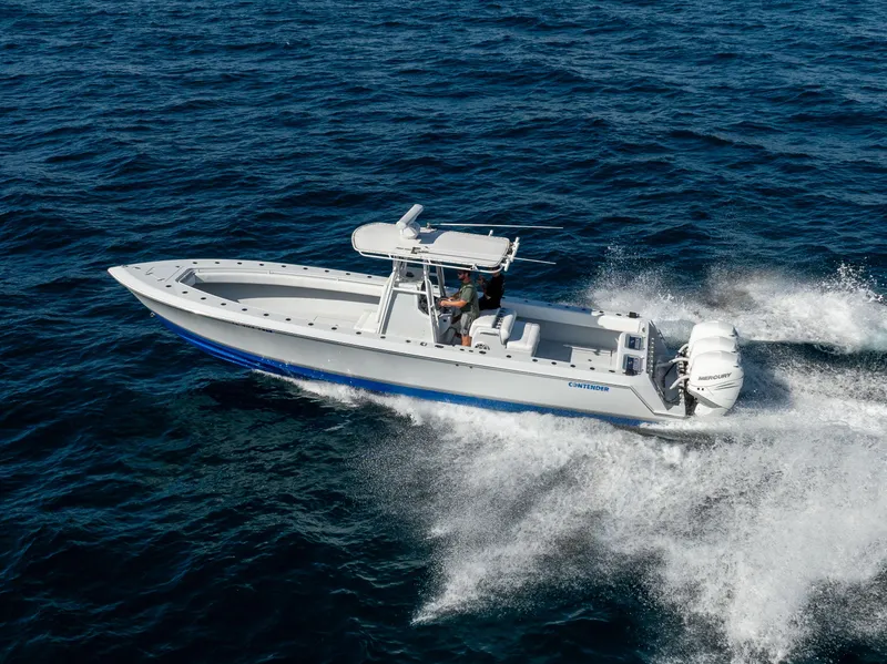 Slide: The Image of 2006 Contender 33 Tournament boat cruising on open water. - 22