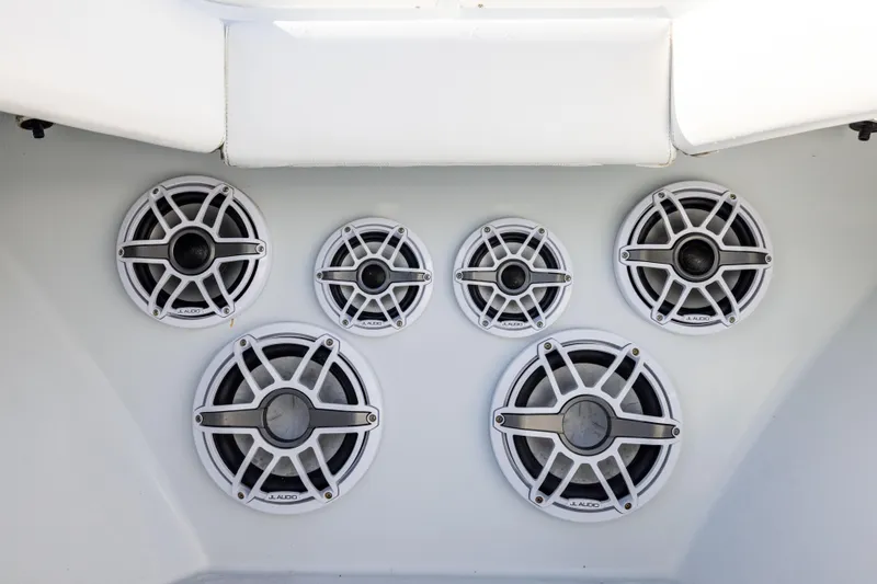 Slide: The Image of Speakers on a 2006 Contender 33 Tournament boat, featuring a sleek white design. - 30
